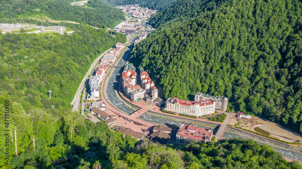 Rosa Khutor plateau, buildings, slopes and chair lifts. Aerial view. Olympic village Roza Khutor.