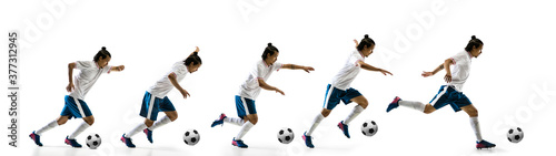 Flying. Football player in motion and action isolated on white background, kicking ball in dynamic. Concept of activity, movement, healthy lifestyle, expression of sport. Young male sportsman.