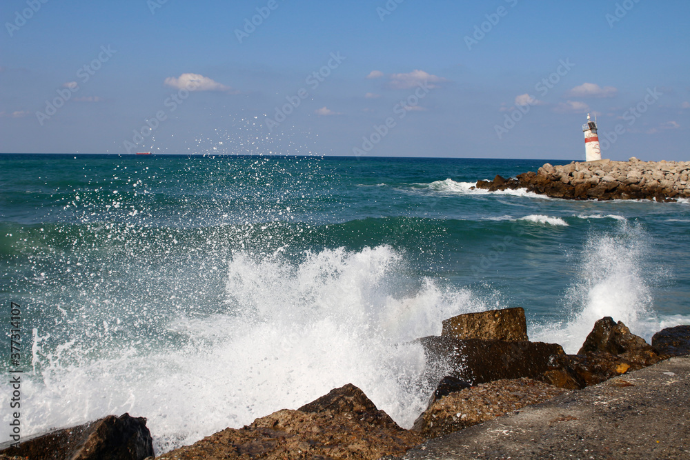 Agva lighthouse. Waves hitting the rocks