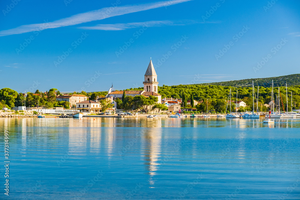 Beautiful old town of Osor between islands Cres and Losinj, Croatia, seascape in foreground
