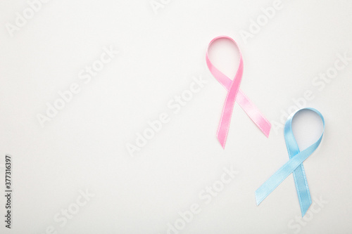 Blue and pink symbolic ribbon - the problem of cancer, breast cancer, prostate cancer ribbon.