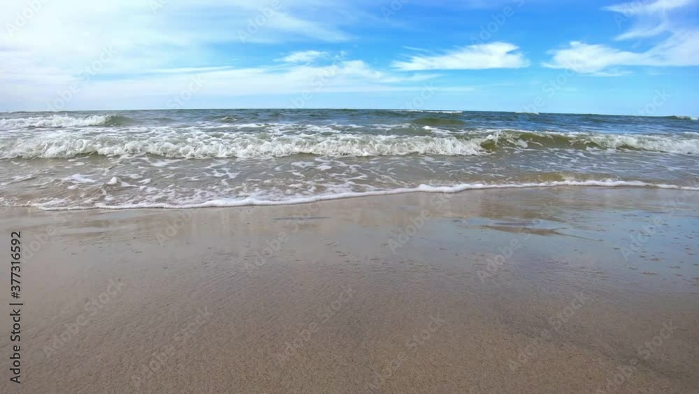 Ocean Waves Crashing on Sandy Beach Slowmotion Shot. Ocean Waves Crashing on Sandy Beach Slowmotion Shot.