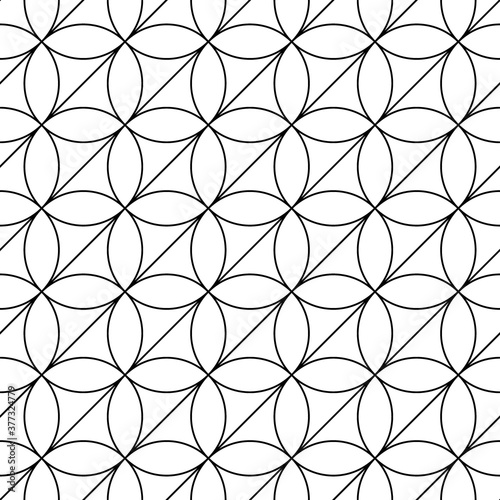 White figures on black background. Texture with ovals and triangles. Ethnic motif. Seamless surface pattern design with circular ornament. Pavement wallpaper. Digital, textile print, web designing.