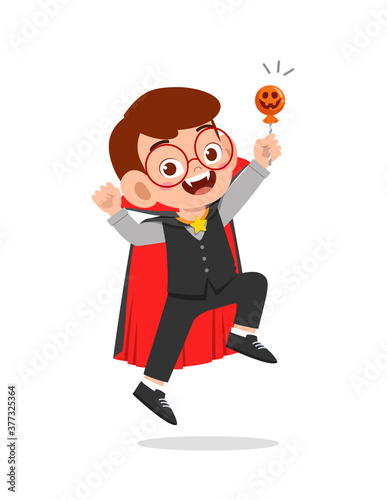 happy cute little kid boy and girl celebrate halloween wears dracula vampire costume with cape