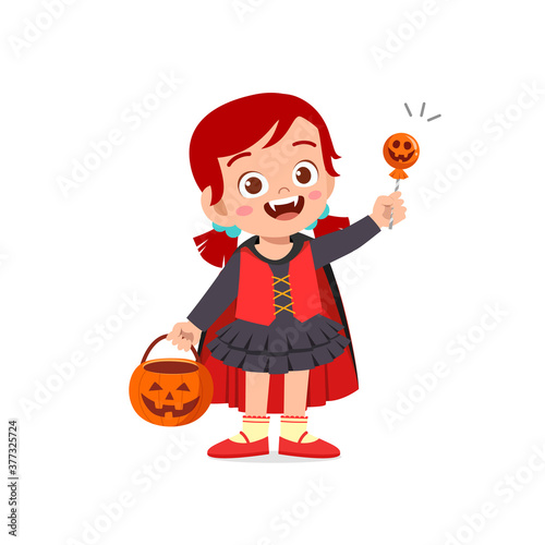 happy cute little kid boy and girl celebrate halloween wears dracula vampire costume with cape