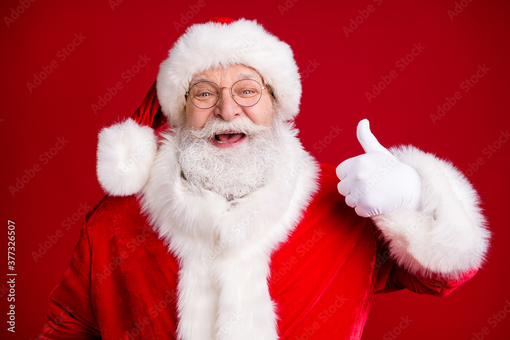 Portrait of crazy funky santa claus show okay sign x-mas season tradition sale wear red costume white gloves isolated over bright shine color background