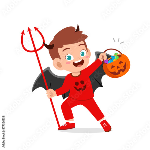 happy cute little kid boy and girl celebrate halloween wears red devil monster costume