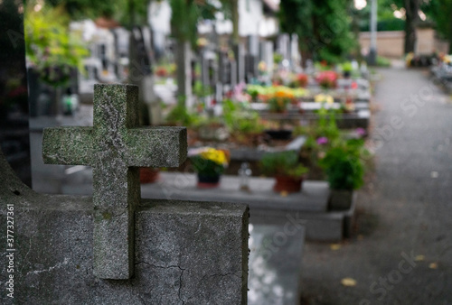 old stone cross in cemetery