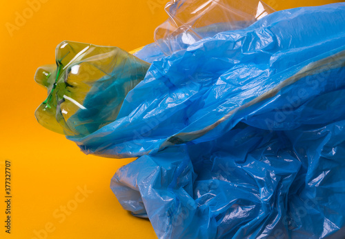plastic trash on yellow background
