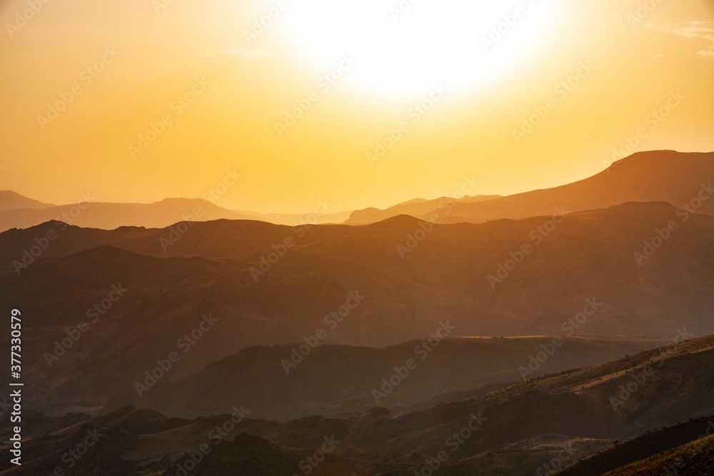 Beautiful sunset landscape. Panoramic view on the mountains on the sunset.