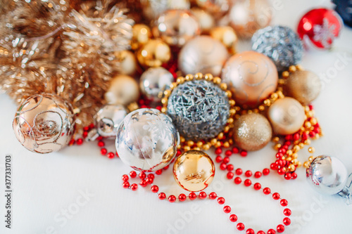 concept of coming holidays such as Christmas and New year presented by golden and silver ornaments balls and bulbs