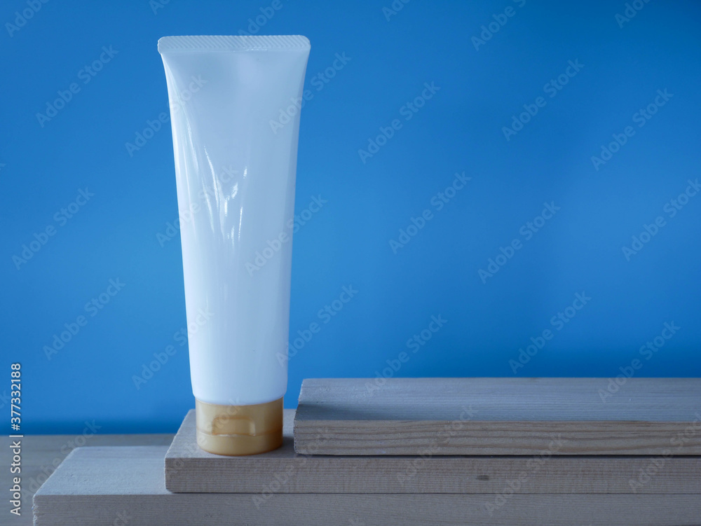 Expired cosmetics on wood table, old cosmetic cream bottle Expired cosmetics on wood table, old cosmetic cream bottle