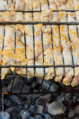 Chicken shish kebab on the grill is prepared on the grill