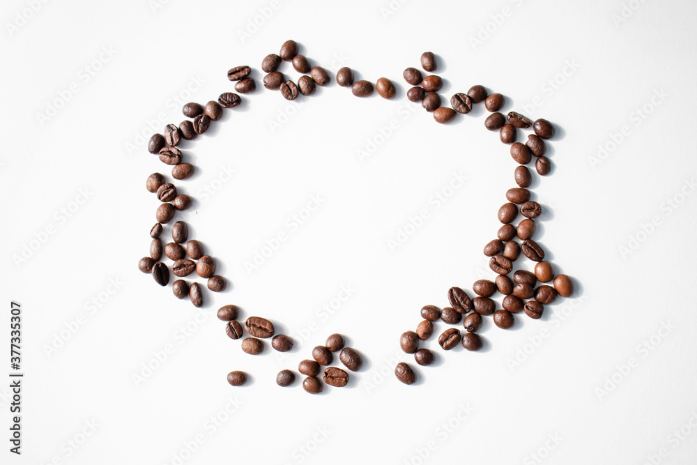 Grains of coffee on a white background. Different shapes made from grains Grains of coffee on a white background. Different shapes made from grains