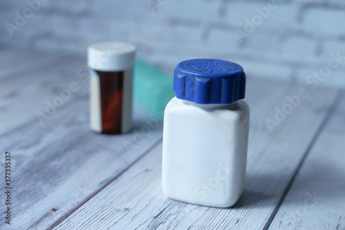 Close up of empty pill container on table 