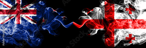 New Zealand vs Georgia, Georgian smoky mystic flags placed side by side. Thick colored silky abstract smoke flags
