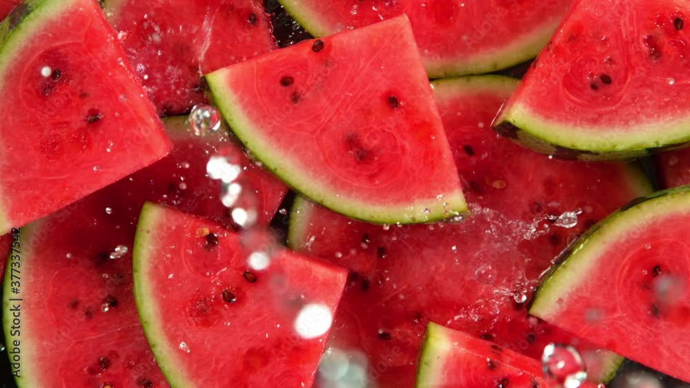 Super Slow Motion Shot of Splashing Water on Fresh Watermelon Slices at 1000fps. Super Slow Motion Shot of Splashing Water on Fresh Watermelon Slices at 1000fps.
