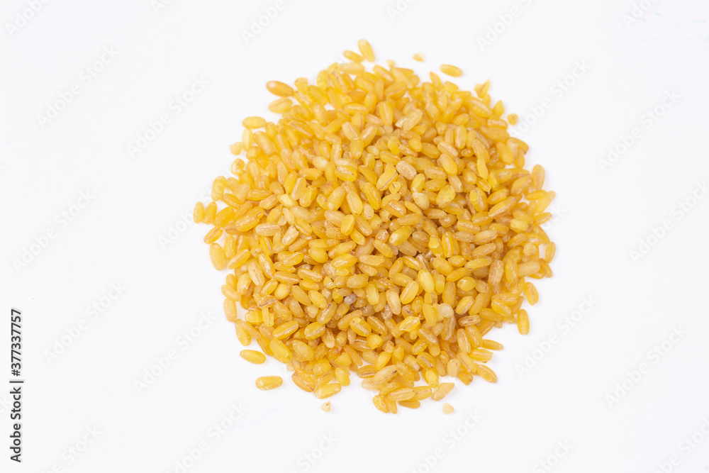 Heap of dry bulgur isolated on white Heap of dry bulgur isolated on white