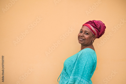 Obraz na plátně Beautiful african senior woman with turban and traditional dress