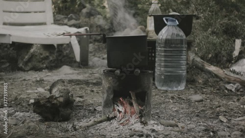 A pot on a fire, the water is boiling