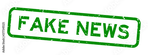 Grunge green fake news word rubber business seal stamp on white background