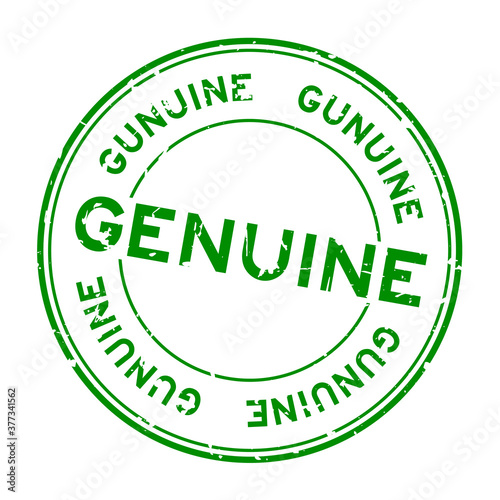 Grunge green genuine word round rubber seal stamp on white background