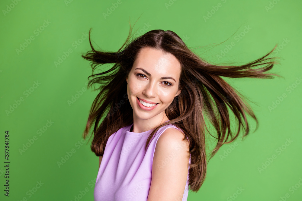 Fototapeta premium Close-up portrait of her she nice-looking attractive pretty cheerful cheery girl enjoying holiday St Saint Patrick day April March shamrock luck wind blowing hair isolated over green color background