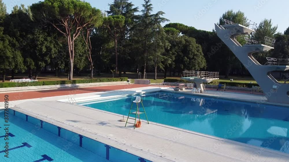 Pivot drone shot for Costoli swimming pool empty for Coronavirus pandemic. Florence Campo Marte area near Fiorentina soccer team stadium. Tuscany, Italy