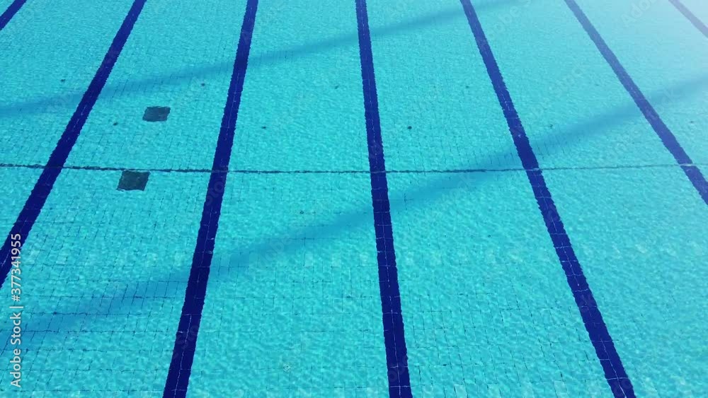 drone shot flying over Costoli empty swimming pool due to Coronavirus pandemic. Florence Campo Marte area near Fiorentina soccer team stadium. Tuscany, Italy