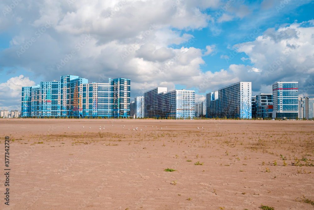 Saint Petersburg / Russia - 9 Sep 2020: Colored multi-storey residential buildings, panorama of the neighborhood in St. Petersburg photographed from the sand Saint Petersburg / Russia - 9 Sep 2020: Colored multi-storey residential buildings, panorama of the neighborhood in St. Petersburg photographed from the sand
