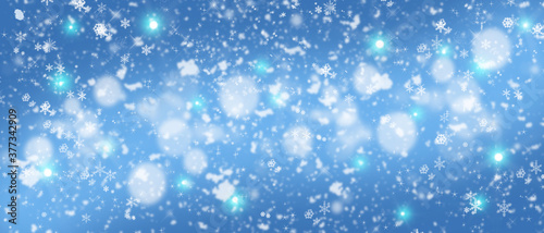 Festive blue Christmas background with glitter and snowflakes. Christmas banner.