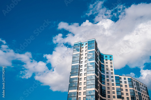 Multi-storey residential modern house against the sky. Residential area. © KseniaJoyg
