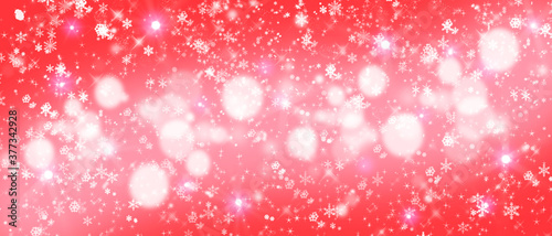 Festive red Christmas background with glitter and snowflakes.