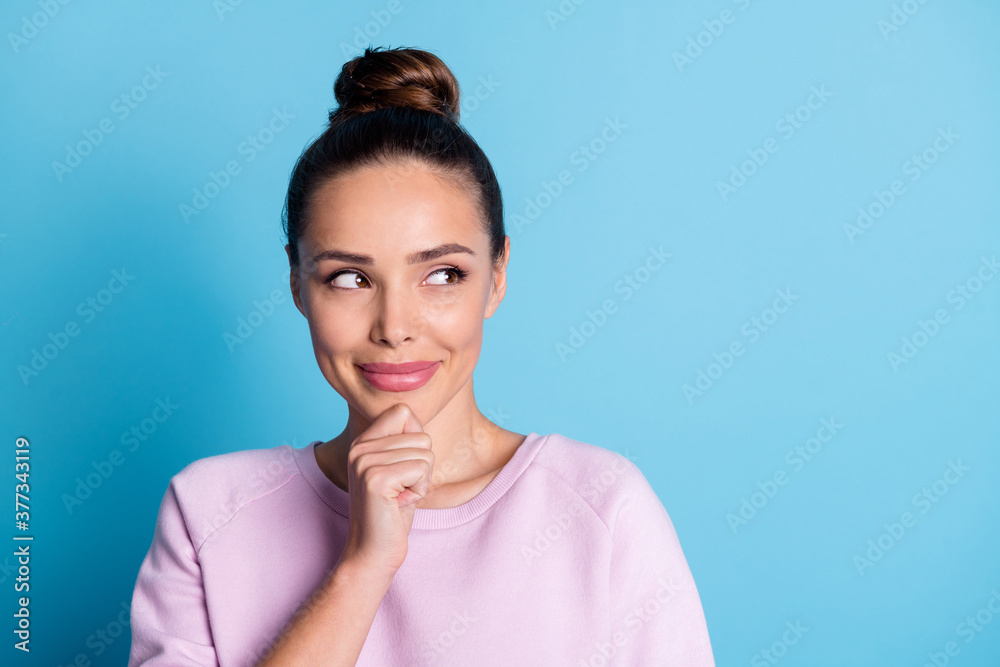 Photo of minded girl touch hands chin look copyspace think thoughts wonder consider cunning plans wear violet pullover isolated over blue color background Photo of minded girl touch hands chin look copyspace think thoughts wonder consider cunning plans wear violet pullover isolated over blue color background