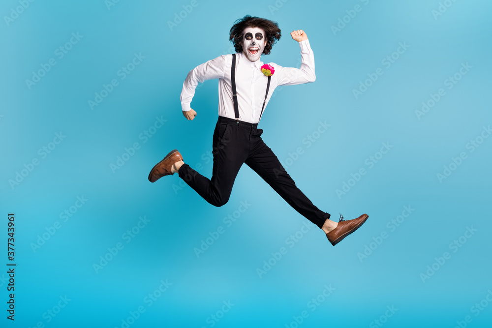Full length body size view of his he handsome funky cheerful cheery active gentleman jumping having fun running fast speed motion calavera isolated bright vivid shine vibrant blue color background