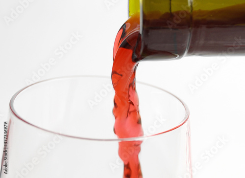 a bottle of wine and a glass
