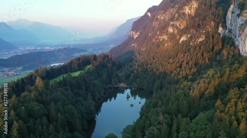 Drone flight over Tyrol landscape, at sunrise in Austria photo