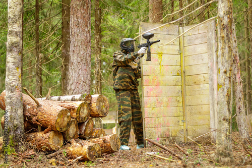 Man playing paintball outdoors