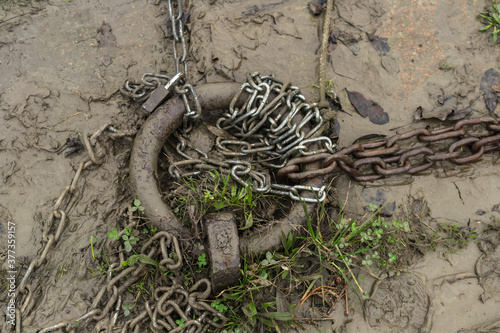 A mud-soaked mooring ring after river flood.