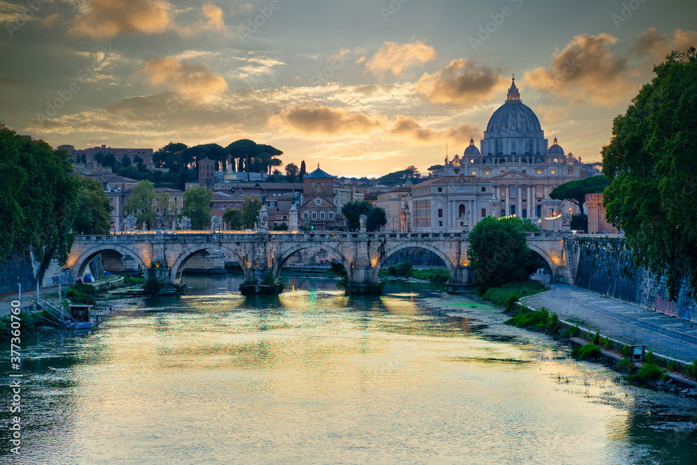 St. Peter Cathedral in Vatican, Rome. Tiber River, Sant'Angelo Bridge, Sunset.