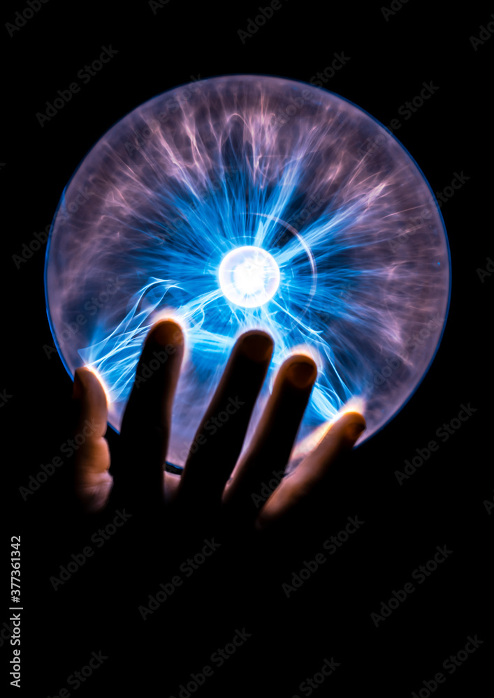 Hand Holding a Plasma Globe. Power Hand Holding a Plasma Globe. Power