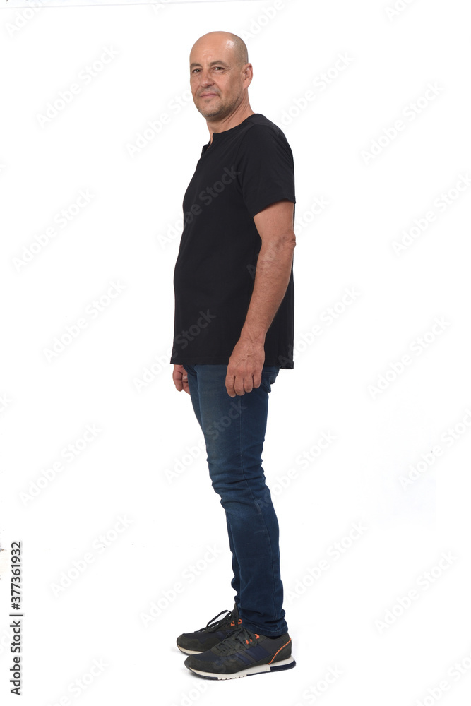 Fototapeta premium full portrait of a man side view and looking at camera on white background