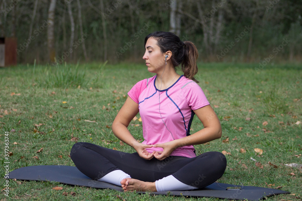 Young Woman Practicing Yoga and training on the nature. Young Woman Practicing Yoga and training on the nature.