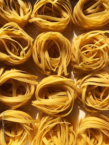 Tagliatelle pasta in a white box macro