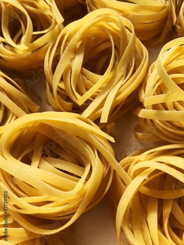 Tagliatelle pasta in a white box macro