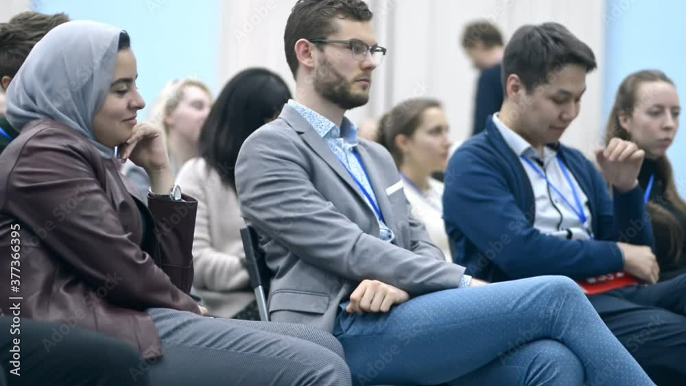 people in audience cheering irrl. diverse audience on business coaching applauding to information they get. concept clapping, lecture, seminar. muslim listener has success on conference people in audience cheering irrl. diverse audience on business coaching applauding to information they get. concept clapping, lecture, seminar. muslim listener has success on conference