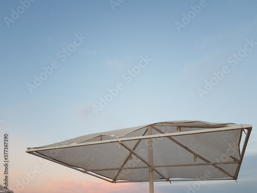 beach umbrella and blue sky © Natalia