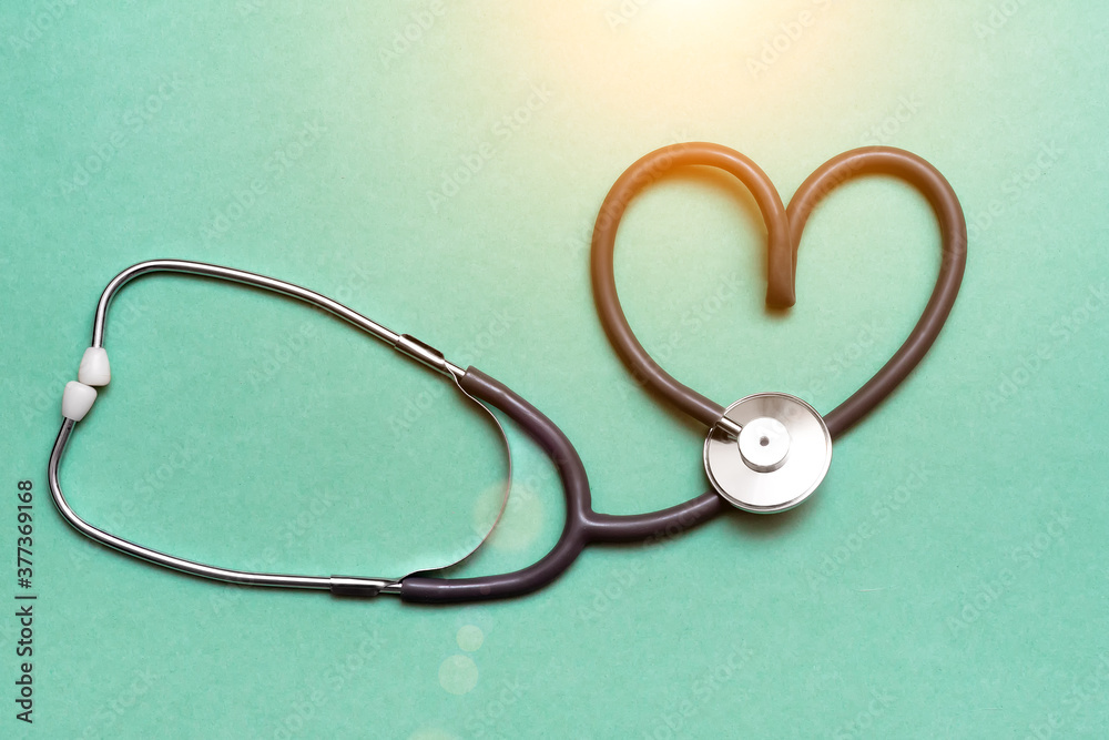 Stethoscope in Shape of Heart Isolated On Green Background. Stethoscope in Shape of Heart Isolated On Green Background.