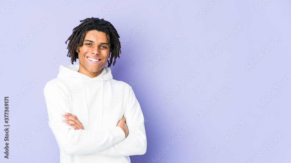 Young african american rasta man who feels confident, crossing arms with determination. Young african american rasta man who feels confident, crossing arms with determination.