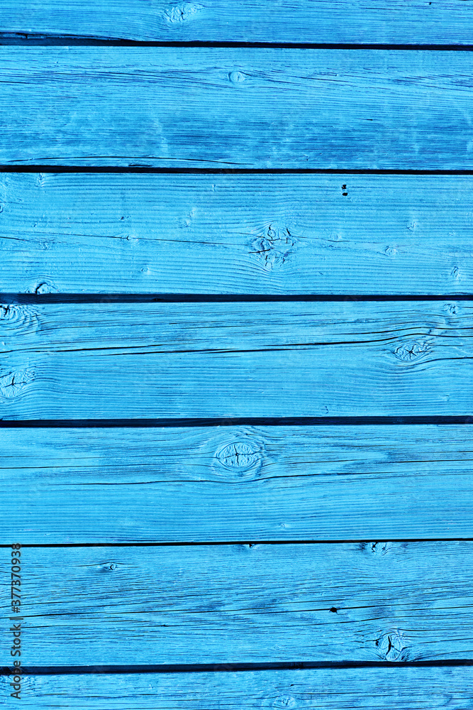 the wall is made of old horizontal boards painted in light blue. old wood texture, vintage style the wall is made of old horizontal boards painted in light blue. old wood texture, vintage style